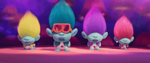 a group of trolls with different colors of hair are dancing
