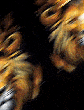a blurred image of a lion 's head with a black background