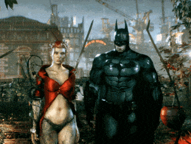 a man in a bat suit and a woman in a red dress are standing in the rain