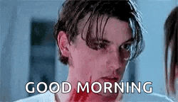 a man with blood on his face is looking at the camera and saying `` good morning '' .