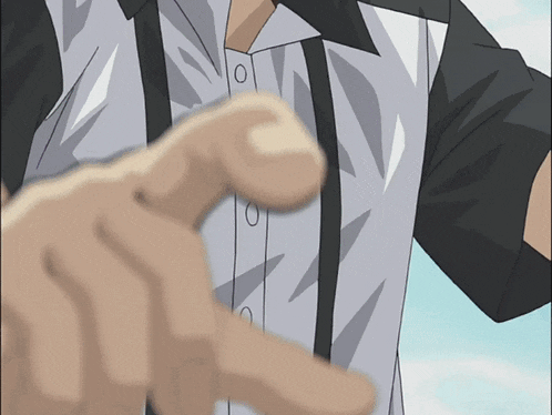 a close up of a person 's hand pointing at the camera