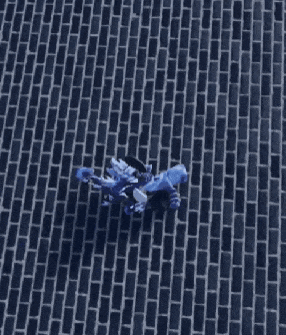 a blue brick wall with a few bricks missing