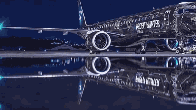 a profit hunter airplane is parked on the runway