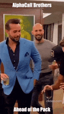 a man in a blue suit is standing next to another man in a black shirt .