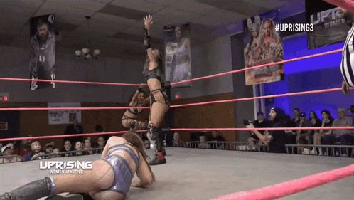 a women 's wrestling match is being broadcasted on uprising