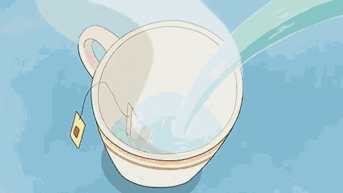 a tea bag is being poured into a cup