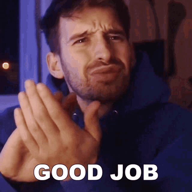 a man in a blue hoodie says good job with his hands