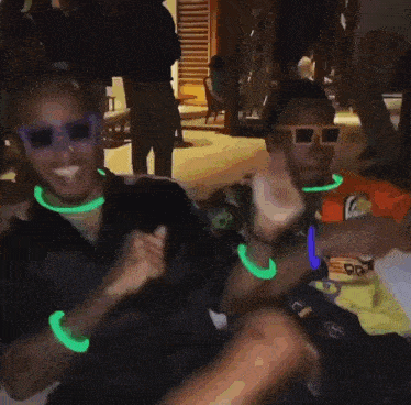 a man wearing glow in the dark glasses and a shirt that says pra