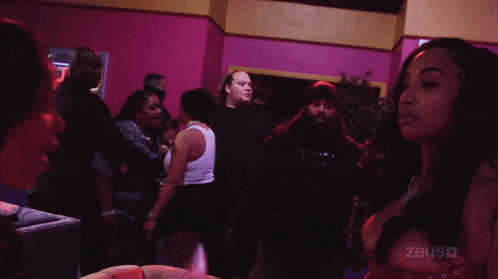 a group of people are dancing in a room with the word zeusa on the bottom