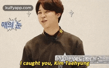a young man is making a funny face and saying `` i caught you , kim taehyun '' .