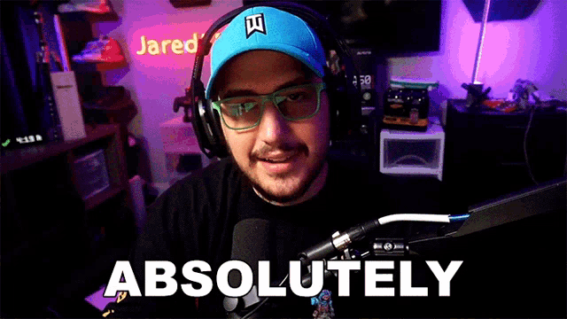 a man wearing headphones and a hat says absolutely