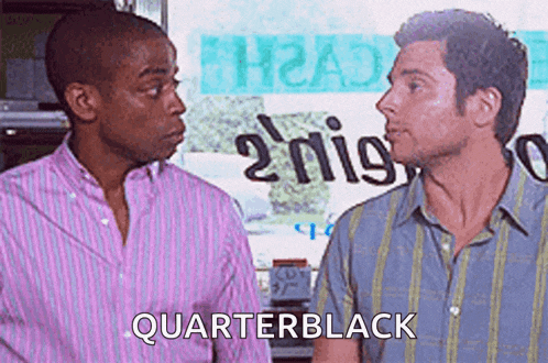 two men standing next to each other and one of them says quarterblack