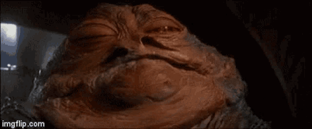a close up of jabba the hutt 's face in a star wars movie .