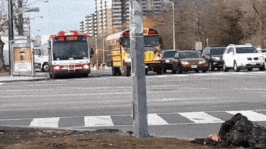 a school bus is driving down a busy street