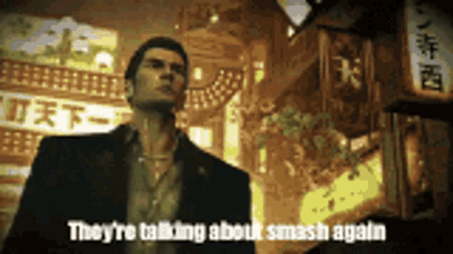 a man in a suit is standing in front of a sign that says " they 're talking about smash again "