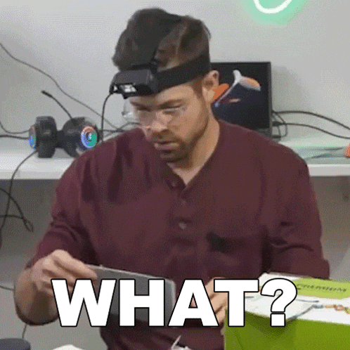 a man wearing glasses and a head light says what