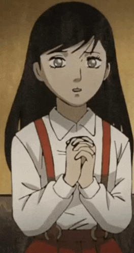 a girl in a white shirt with red suspenders is praying