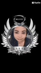 a woman is looking at herself in a mirror with wings .