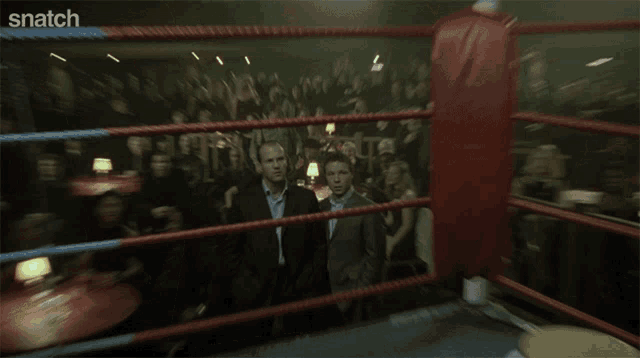 two men are standing next to each other and the word snatch is on the bottom