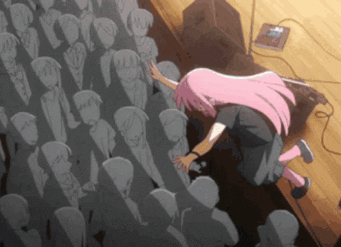 a girl with pink hair is standing in front of a crowd