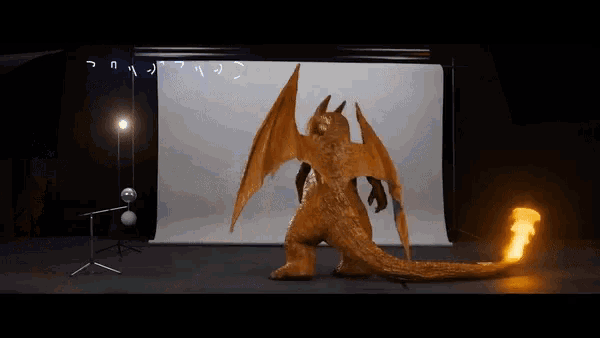 a dragon with wings is standing in front of a white board that says ' n ' on it