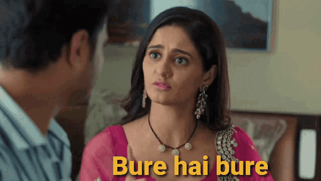 a woman in a pink dress is talking to a man with the words bure hai bure written in yellow