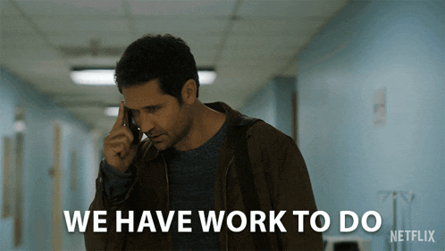 a man talking on a cell phone with the words " we have work to do " written below him