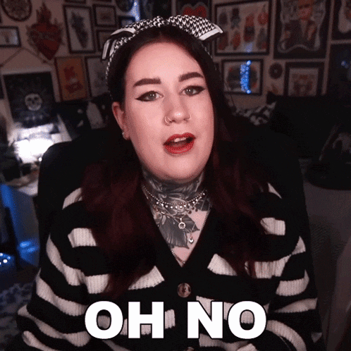 a woman in a black and white striped sweater says " oh no "