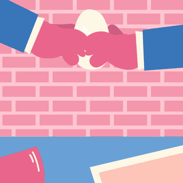 a pink brick wall is behind two hands shaking hands