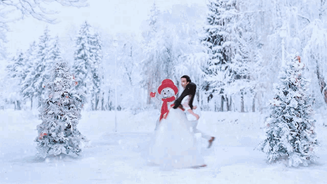 a woman in a white dress is standing in the snow with her hair blowing in the wind
