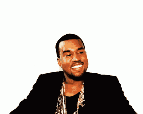 kanye west is wearing a black jacket and a gold necklace .