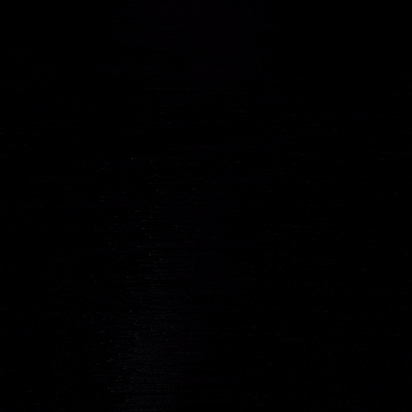 a black and white photo of a cloud in the night sky