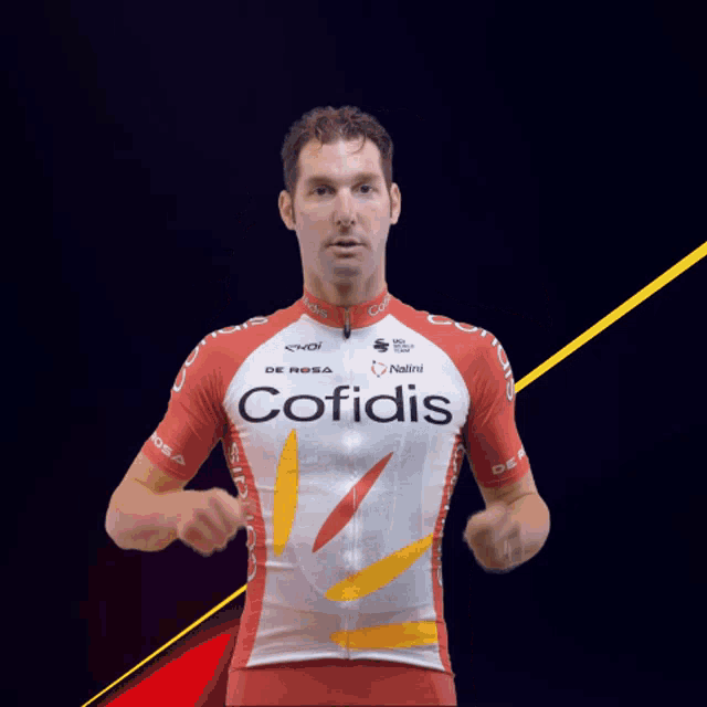 a man in a red and white cofidis jersey giving two thumbs up
