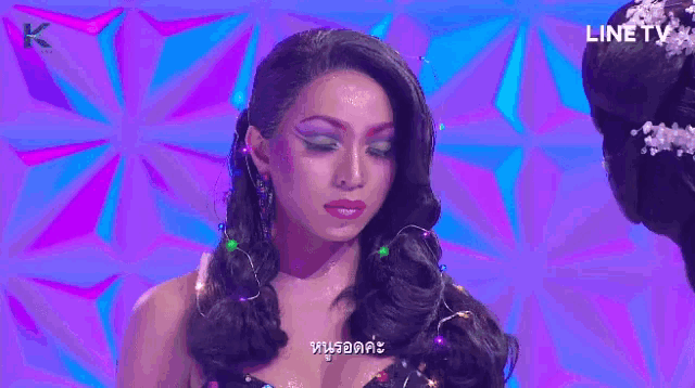 a purple background with a line tv logo on the bottom