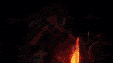 a blurry picture of a girl with red hair