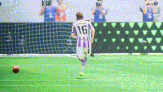 a soccer player wearing a purple and white jersey with the number 16 on it