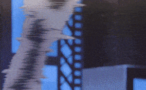 a blurred image of a person 's face with a blue background