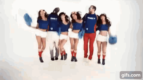 a group of people standing next to each other with one wearing a shirt that says ' france ' on it