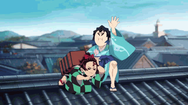 a man and a woman are sitting on a roof and the woman is waving