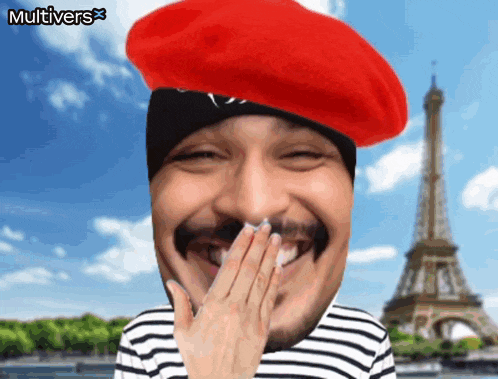 a man wearing a red beret covering his mouth with his hand