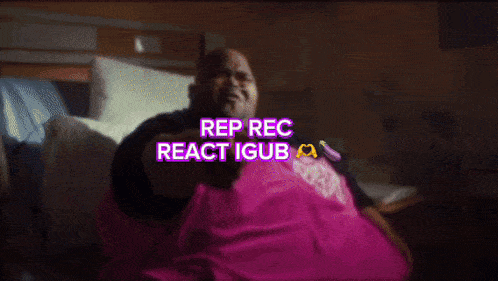 a man in a pink and black jacket with the words rep rec react igub written on it