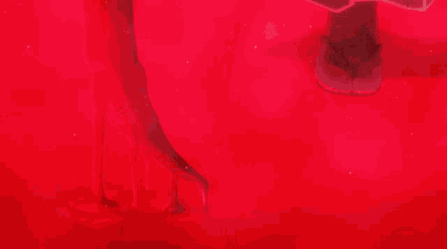 a man in a white robe is holding a sword in a red light