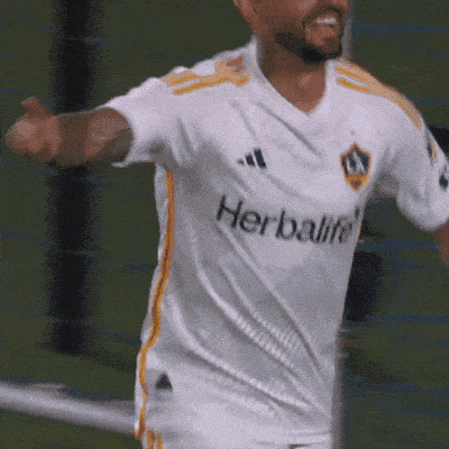 a man wearing a white adidas herbalife jersey