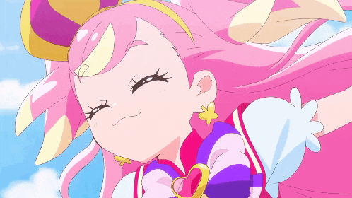 a girl with pink hair and a heart shaped pendant