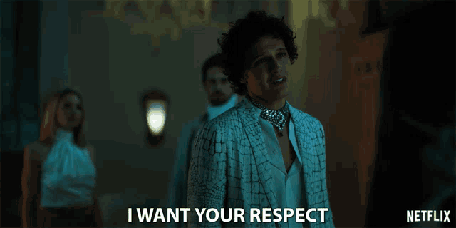 a man in a white suit says " i want your respect " in a netflix ad