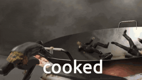 the word cooked is on the bottom of a frying pan