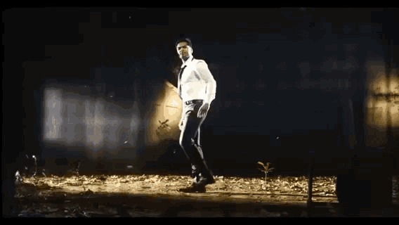 a man walking in the dark with the words this is not the end but the beginning behind him