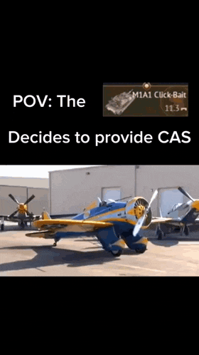 a blue and yellow airplane is parked in front of a building that says m1a1 click bait