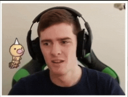 a man wearing headphones is sitting in a green chair with a cartoon worm behind him .