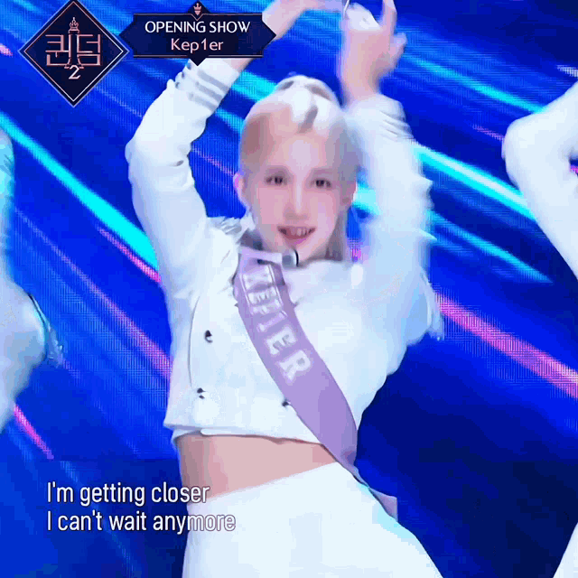a woman in a white crop top with a sash that says kepler